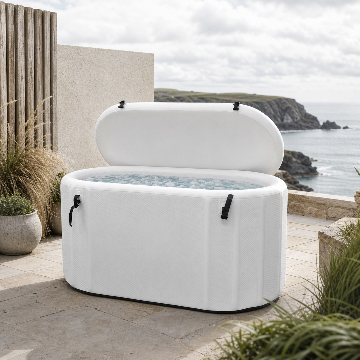 White inflatable cold plunge on a contemporary Cornish coastal terrace