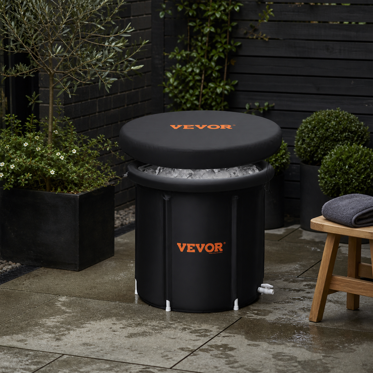 Portable black folding cold plunge in a compact London garden